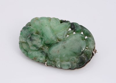 Lot 123 - A jadeite jade oval pierced brooch