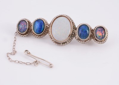 Lot 130 - A five stone graduated oval synthetic opal & doublets brooch