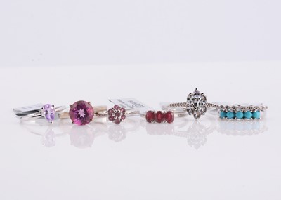 Lot 144 - A collection of silver various coloured gen set rings some with certs