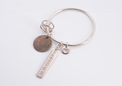 Lot 146 - A silver bangle marked Tiffany& Co 925
