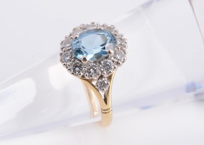 Lot 167 - A 18ct gold aquamarine & diamond cluster ring