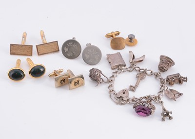 Lot 174 - A silver charm bracelet, together with metal cufflinks
