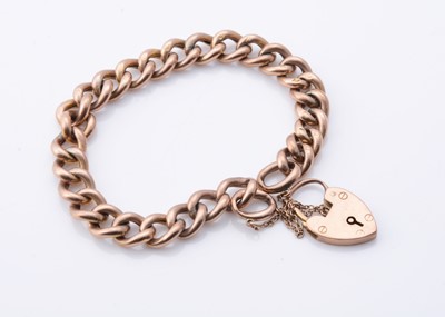 Lot 181 - A 9ct gold curb bracelet with padlock