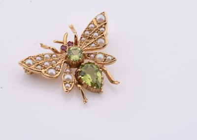 Lot 210 - A 9ct gold peridot & seed pearl butterfly brooch