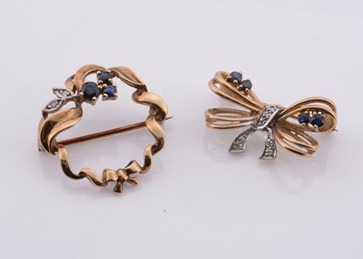 Lot 211 - Two 9ct gold brooches set with diamonds & sapphires