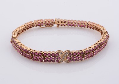 Lot 217 - A ruby & diamond set multi row line bracelet