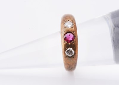 Lot 220 - A diamond & ruby three stone gypsy set ring