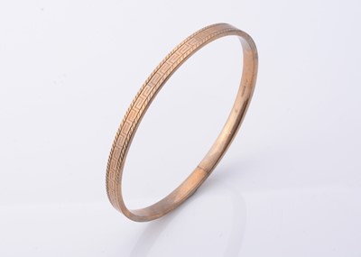 Lot 241 - A 9ct gold arm bangle