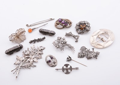 Lot 248 - A collection of silver brooches & other white metal items