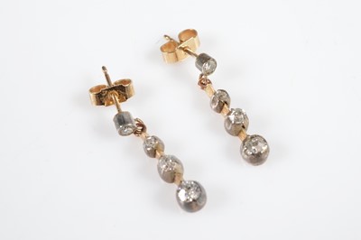 Lot 252 - A pair of Edwardian diamond stud and three drop earrings