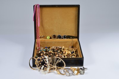Lot 253 - A silver oval engraved locket, on a chain, an enamel circular pendant, and a coin necklace
