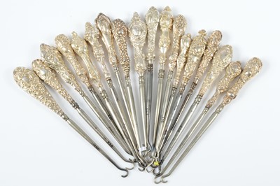 Lot 274 - Eighteen silver handled button hooks