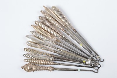 Lot 280 - Thirteen silver handled button hooks