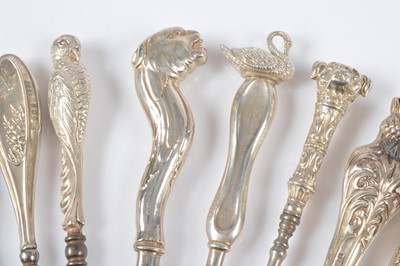 Lot 282 - Thirteen novelty silver handled button hooks