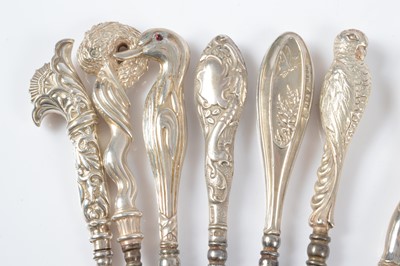 Lot 282 - Thirteen novelty silver handled button hooks