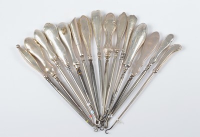 Lot 290 - Fifteen silver handled steel button hooks