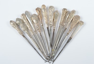 Lot 292 - Fourteen silver handled steel button hooks