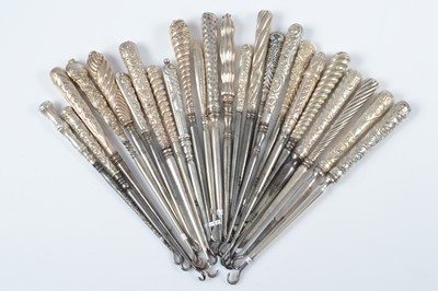 Lot 294 - A collection of tapered silver handled button hooks