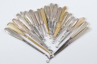 Lot 296 - A collection of silver engine turn decorated handled steel button hooks