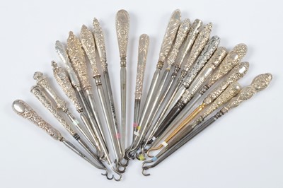 Lot 297 - A collection of tapered silver handled button hooks