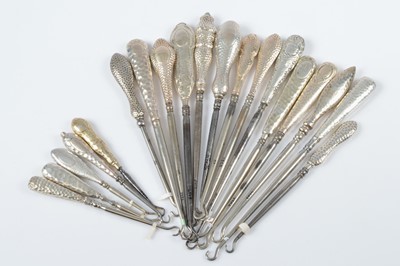 Lot 298 - A collection of hammered and beaten silver handled steel button hooks