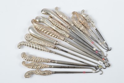 Lot 300 - A collection of pistol grip and shell silver handled steel button hooks