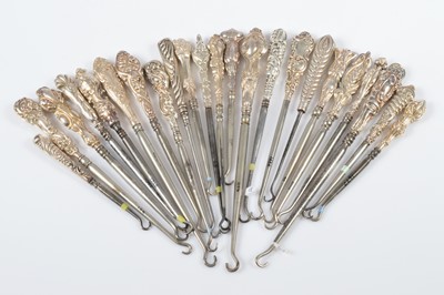 Lot 305 - A collection of art nouveau style silver handled button hooks