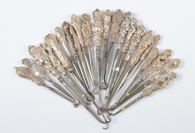 Lot 307 - A collection of silver handled steel button hooks