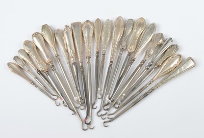 Lot 309 - A collection of silver handled steel button hooks
