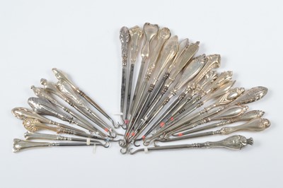 Lot 310 - A collection of art deco and art nouveau style silver handled button hooks