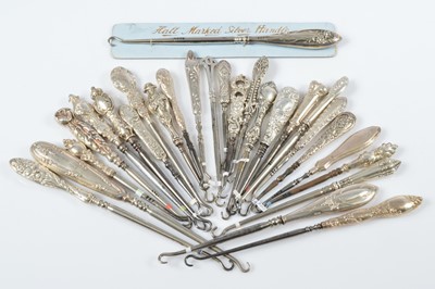 Lot 313 - A collection of silver handled steel button hooks