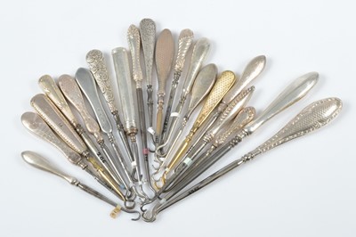 Lot 314 - A collection of silver and silver gilt handled steel button hooks