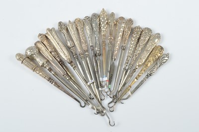 Lot 315 - A collection of silver handled steel button hooks