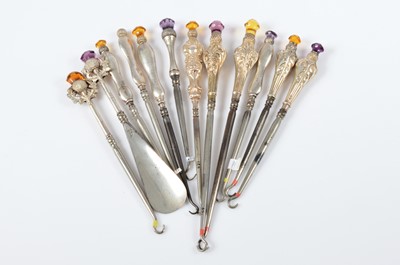 Lot 317 - A collection of silver handled steel button hooks