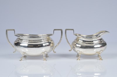 Lot 326 - A George V silver milk jug and sugar basin by J.S