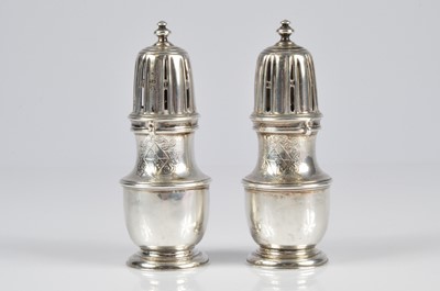 Lot 331 - A rare pair of William III silver peppers by John Chartier