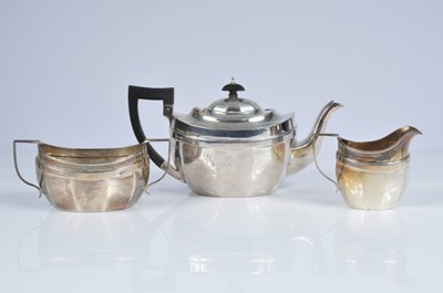 Lot 372 - A George V silver three piece tea set by the Baker Brothers