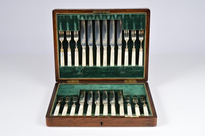 Lot 390 - A boxed set of twelve George V period silver and mother of pearl dessert knives and forks