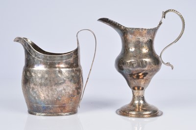 Lot 405 - Two Georgian silver milk jugs