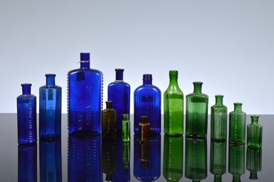 Lot 24 - A collection of thirteen poison and other toxic liquid bottles