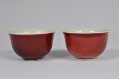 Lot 60 - A pair of Chinese Sang Du Beouf porcelain tea bowls