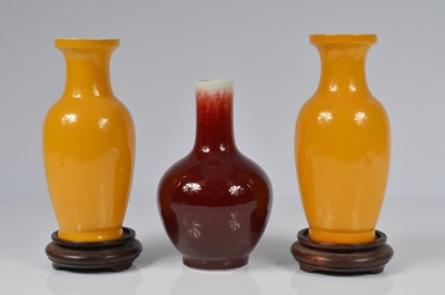 Lot 69 - A pair of modern Chinese porcelain vases and another vase