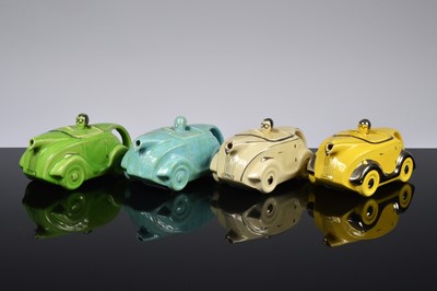 Lot 92 - Four Art Deco period Sadler Pottery racing car teapots