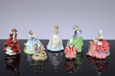 Lot 104 - Seven Royal Doulton figures and a Dresden figural group