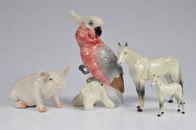 Lot 130 - A Beswick pottery cockatiel and two horses