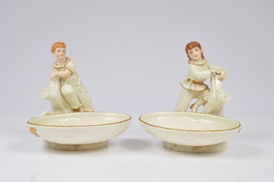 Lot 142 - A pair of Royal Worcester porcelain figural dishes