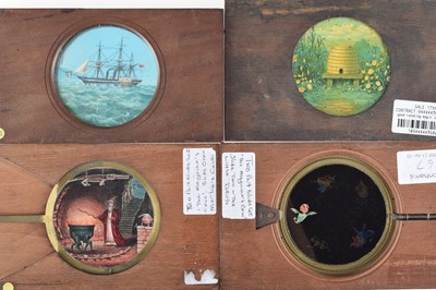 Lot 23 - Four Mahogany Mounted Hand Cranked Rotary and one lever Magic Lantern Slides